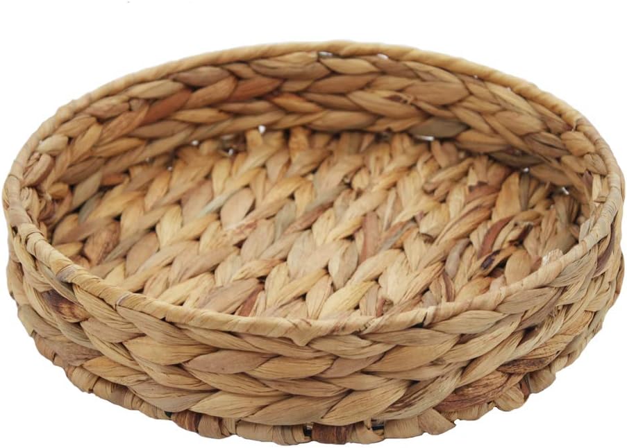 A round, shallow woven basket made from natural fibers, displayed on a white background.