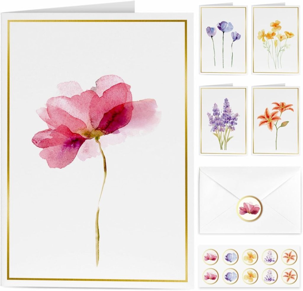 Greeting card set featuring watercolor floral designs, including a large pink flower card, four smaller cards with different flowers, envelopes, and matching floral stickers.