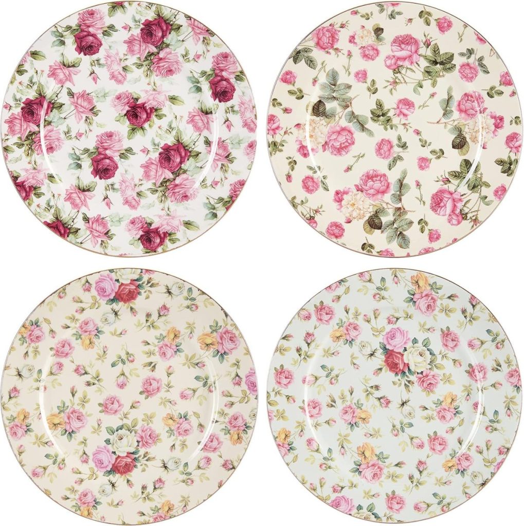 Four round plates with different floral patterns in shades of pink, green, and cream, each featuring various arrangements of roses and leaves.