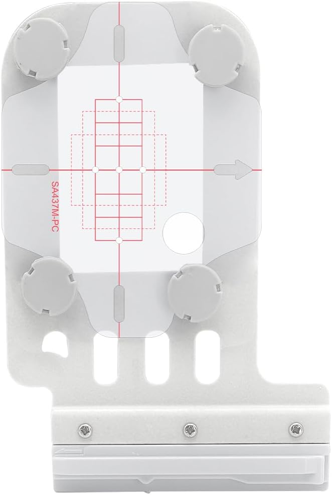 White plastic camera calibration tool with four round dials, alignment grid, red calibration lines, and a metallic base with three screws at the bottom.