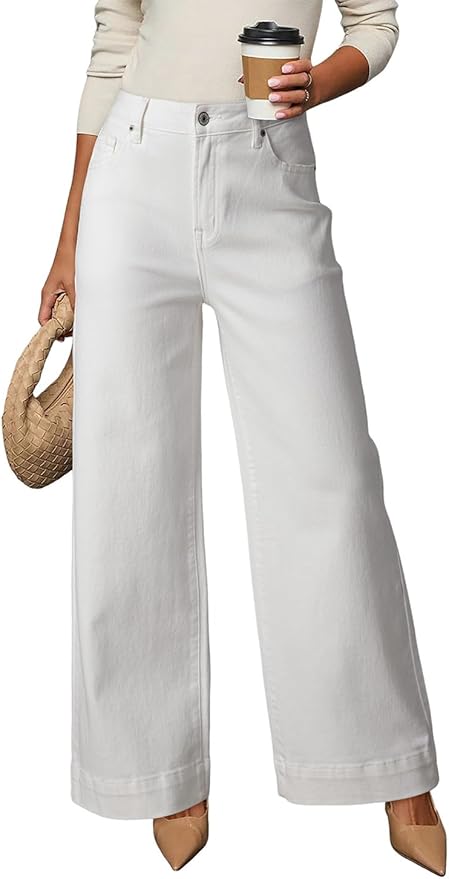 A person wearing high-waisted, wide-leg white jeans from the Amazon Big Spring Sale, holding a woven bag and a to-go coffee cup, paired with beige pointed-toe shoes.