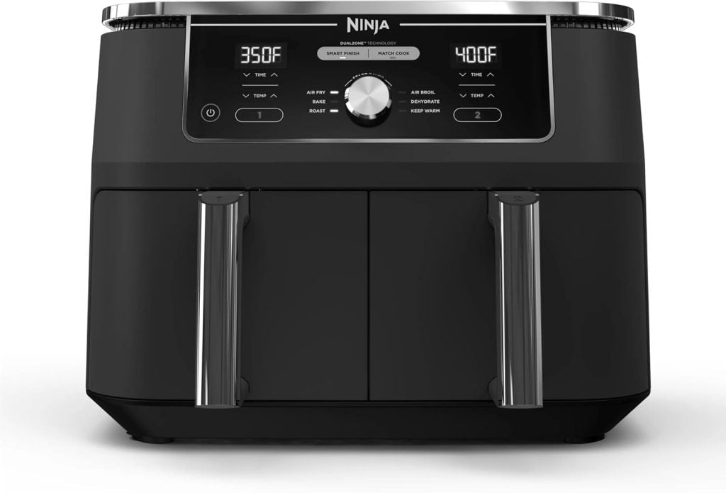A black Ninja air fryer with dual drawers, digital display showing 350&deg;F and 400&deg;F, and control knobs and buttons for separate cooking functions&mdash;perfect for upgrade during the Amazon Big Spring Sale.