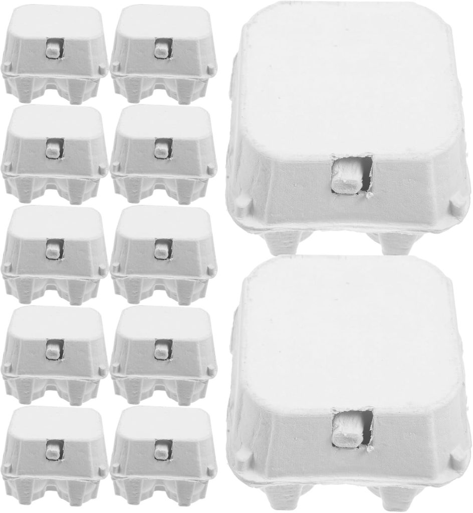 Ten small white egg cartons and two larger ones are arranged in a grid pattern on a plain white background, perfect for inspiring Egg Carton Crafts.