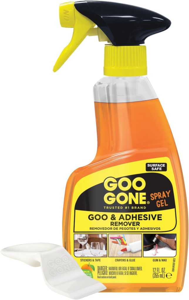 A 12 fl oz bottle of Goo Gone Spray Gel Goo & Adhesive Remover with a yellow spray nozzle and a white plastic scraper tool&mdash;perfect for cleaning up sticky residue from window wreaths.