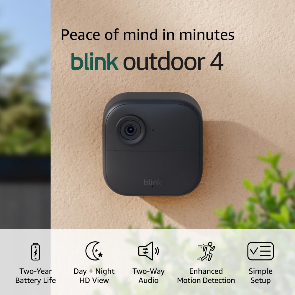 Blink Outdoor 4 security camera mounted on a wall, showcasing two-year battery life, HD view, two-way audio, motion detection, and easy setup&mdash;now featured in the Amazon Big Spring Sale.
