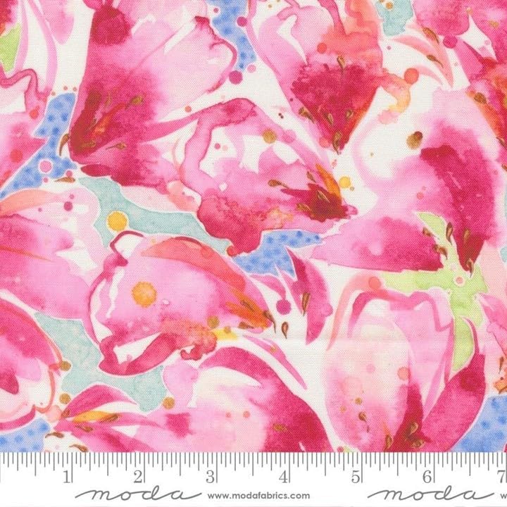 Pink and red watercolor-style floral fabric with green and blue accents, shown with a ruler at the bottom for scale.