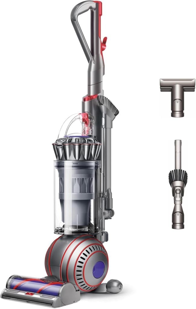 Upright vacuum cleaner with a transparent dust bin, ball base, and two detachable cleaning attachments shown on the right&mdash;now available during the Amazon Big Spring Sale.