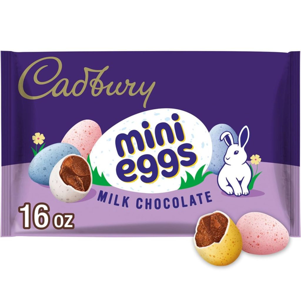 A 16 oz bag of Cadbury mini eggs milk chocolate, featuring colorful candy eggs and a white rabbit on a purple package.