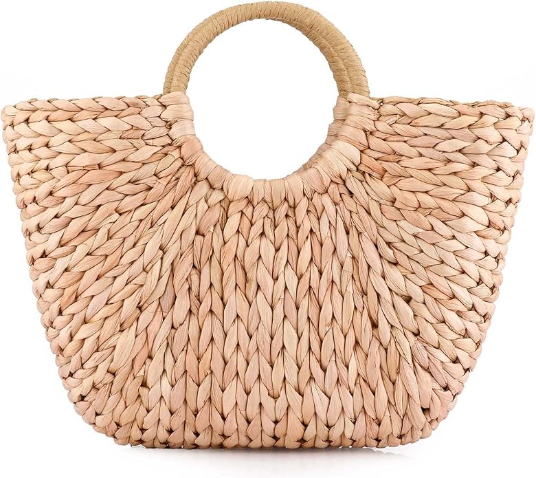 A woven straw handbag with round handles and a wide, slightly curved shape&mdash;perfect for sunny days and now available during the Amazon Big Spring Sale.