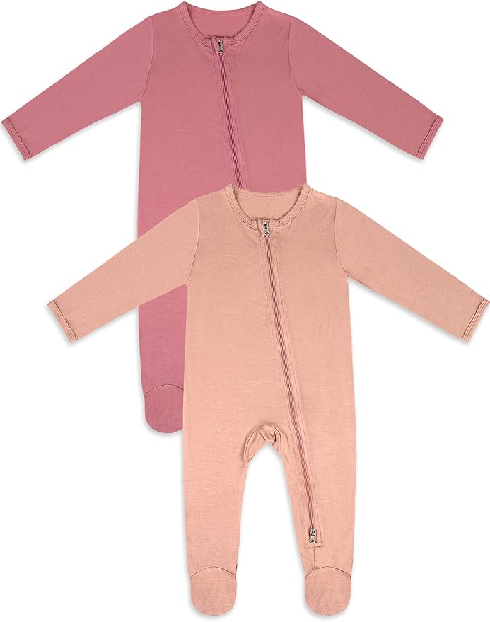 Two long-sleeve baby onesies with front zippers, one in mauve and one in light pink, laid flat on a white background.
