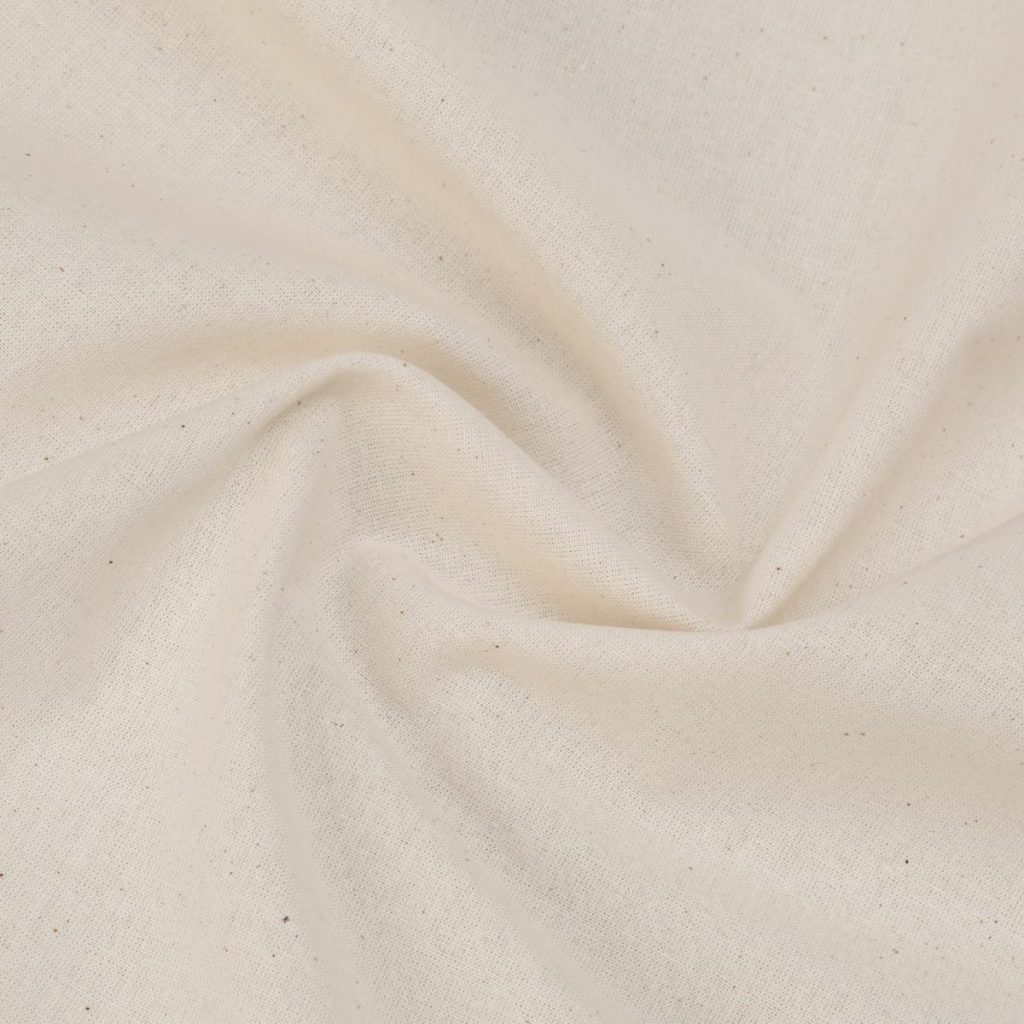 A close-up view of a piece of off-white fabric twisted at the center, showing its texture and weave pattern.