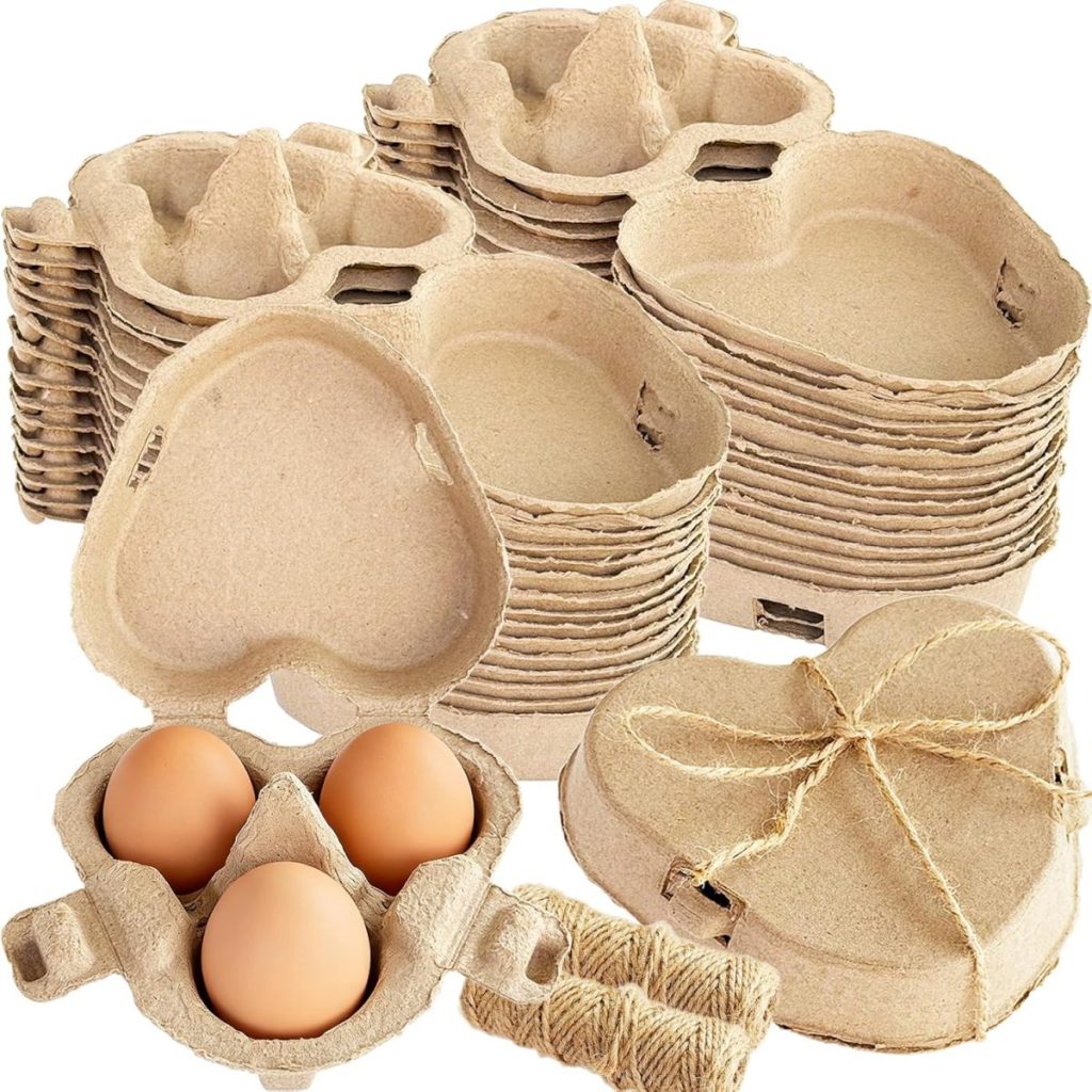 Stacked heart-shaped egg cartons with three brown eggs in one, a bundle of twine in front—perfect inspiration for charming Egg Carton Crafts.