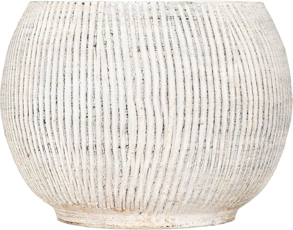 A round, white ceramic planter with vertical textured grooves and a slightly distressed finish&mdash;perfect for refreshing your space during the Amazon Big Spring Sale.
