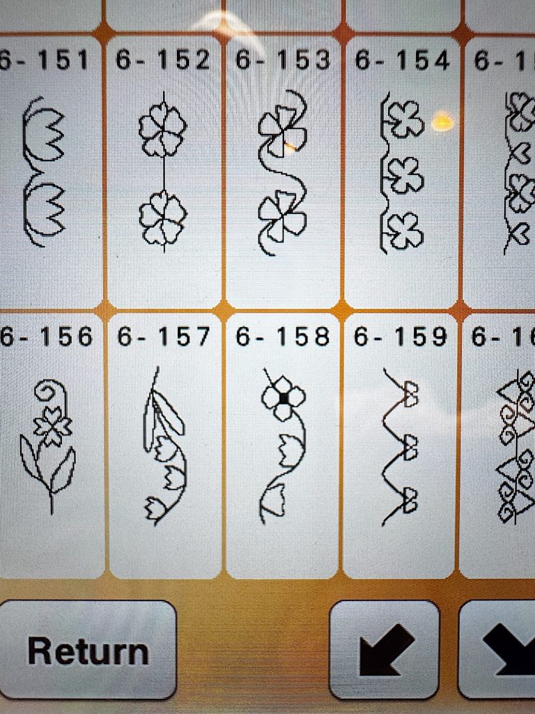 A digital screen displays eight floral embroidery pattern options, each numbered 6-152 to 6-159, with "Return" and navigation arrow buttons at the bottom.