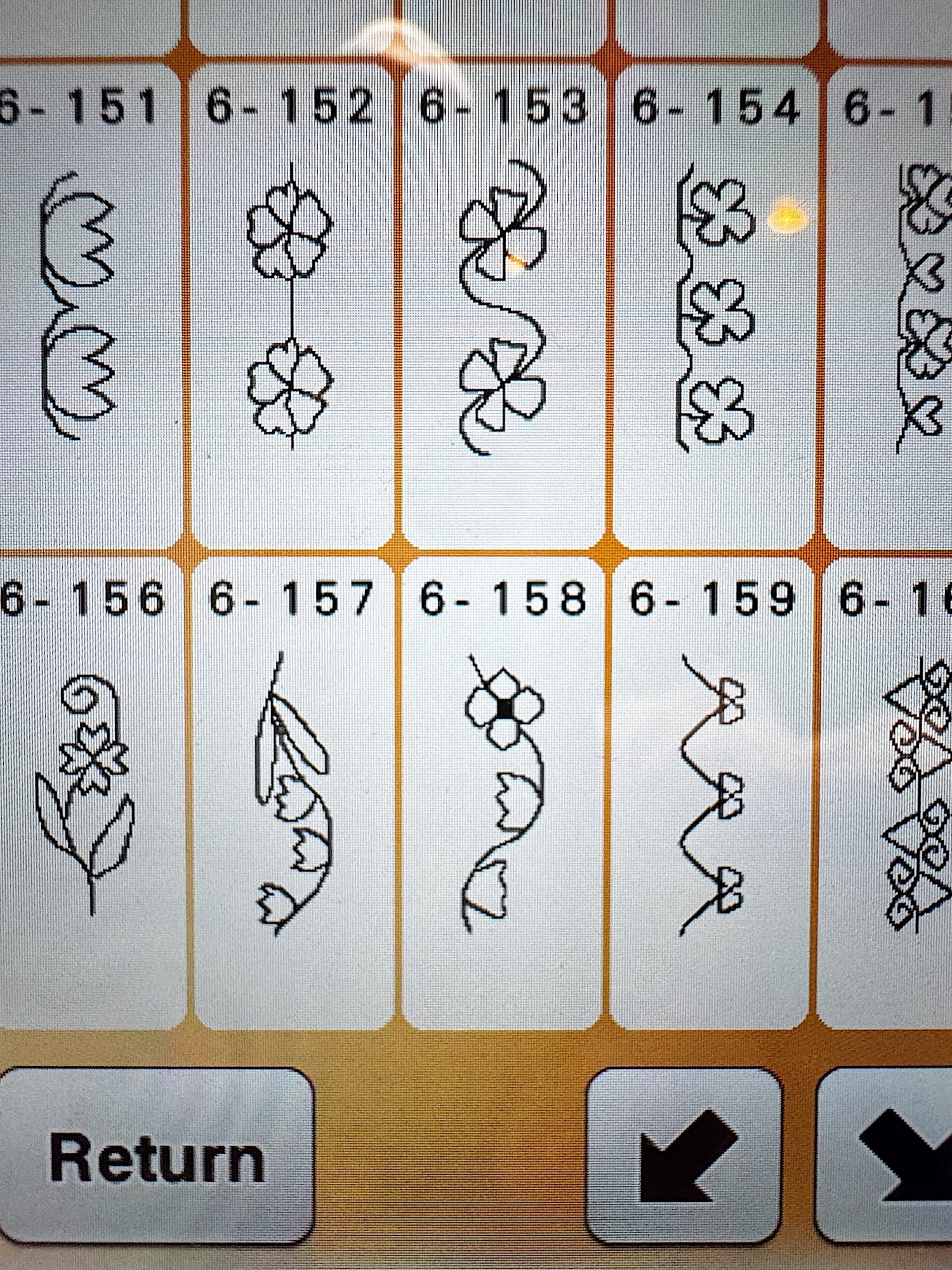A digital screen displays eight floral embroidery pattern options, each numbered 6-152 to 6-159, with "Return" and navigation arrow buttons at the bottom.