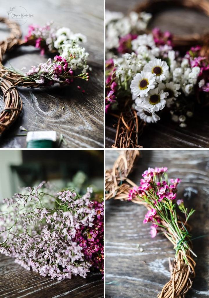 Four close-up shots show a grapevine wreath being decorated with small white and pink flowers on a wooden surface.