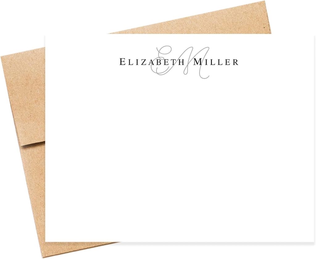 White notecard with the name "Elizabeth Miller" and the initials "EM" in script at the top center, placed on a brown envelope.