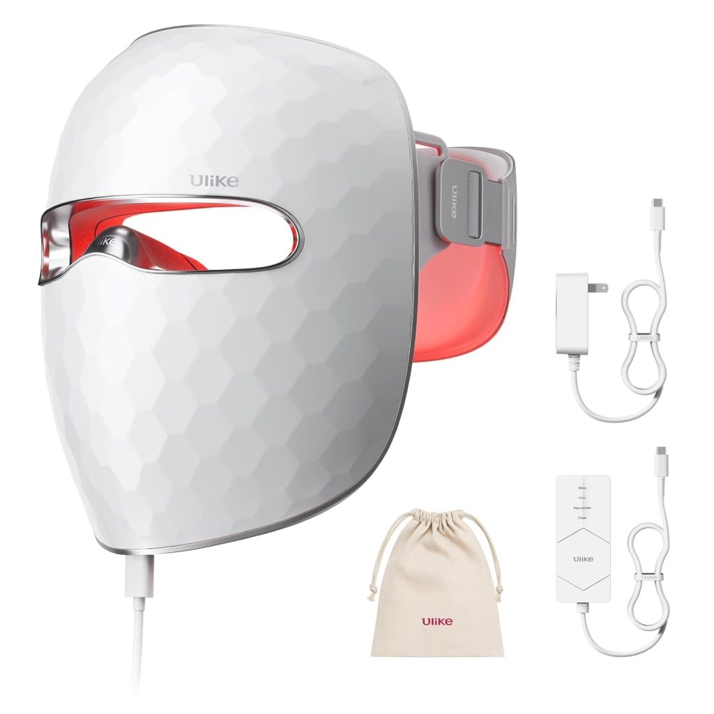 A white LED facial mask with a geometric design, adjustable head strap, power adapter, control unit, and a beige drawstring storage pouch&mdash;an ideal pick for Mother's Day Gifts on Amazon.