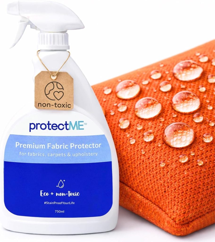 A bottle of ProtectME Premium Fabric Protector stands next to an orange fabric with water droplets beading on its surface.