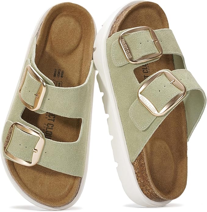 A pair of light green suede sandals with two adjustable gold buckles and white soles, featuring a contoured brown footbed&mdash;perfect for Mother's Day Gifts on Amazon.
