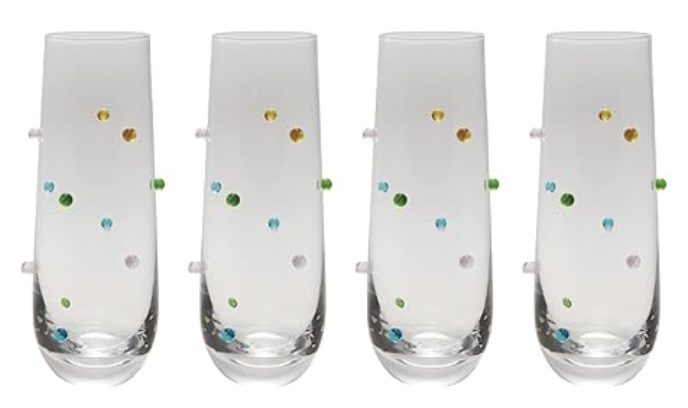 Four clear glass tumblers with multicolored raised dots arranged in a row against a white background, perfect for serving refreshing lemon vodka cocktails.