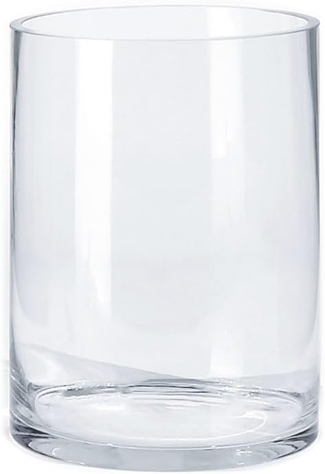 A clear, empty glass tumbler stands upright on a white background, reminiscent of the minimalist aesthetic favored by Theo of Golden Book Club.