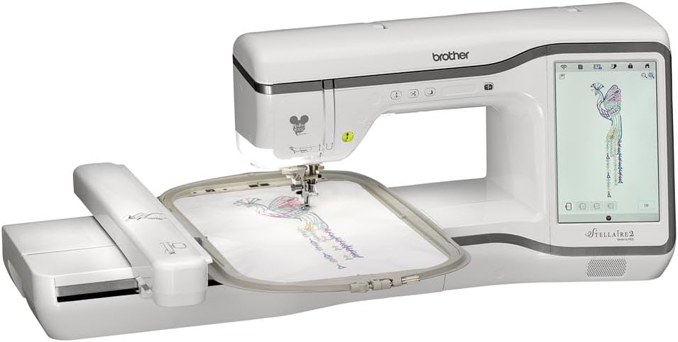Brother embroidery machine with a touchscreen display is stitching a colorful peacock design onto fabric held in an embroidery hoop.