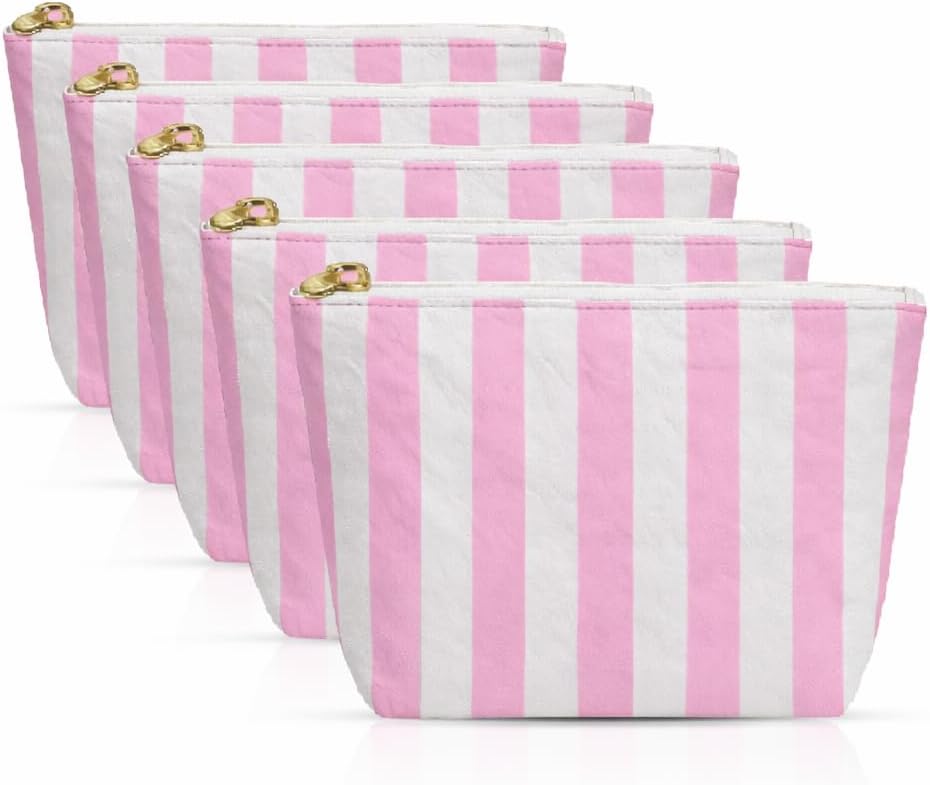 Five zippered pouches with pink and white vertical stripes are arranged in a row, each featuring a gold zipper.