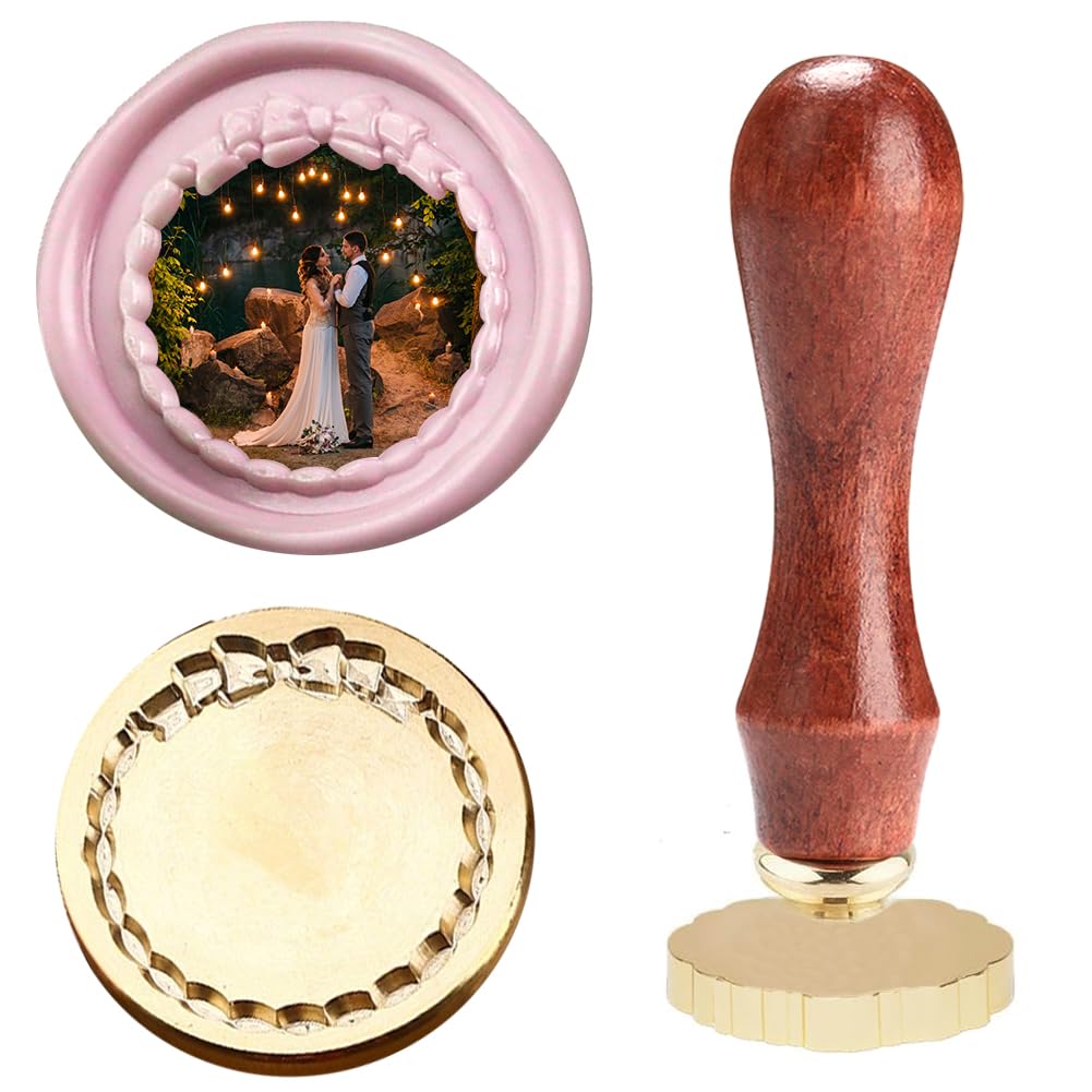 A round wax seal stamp with a scalloped edge, a wooden handle, and an example seal showing a bride and groom under string lights&mdash;perfect for adding romantic wax seals to your invitations or wedding stationery.