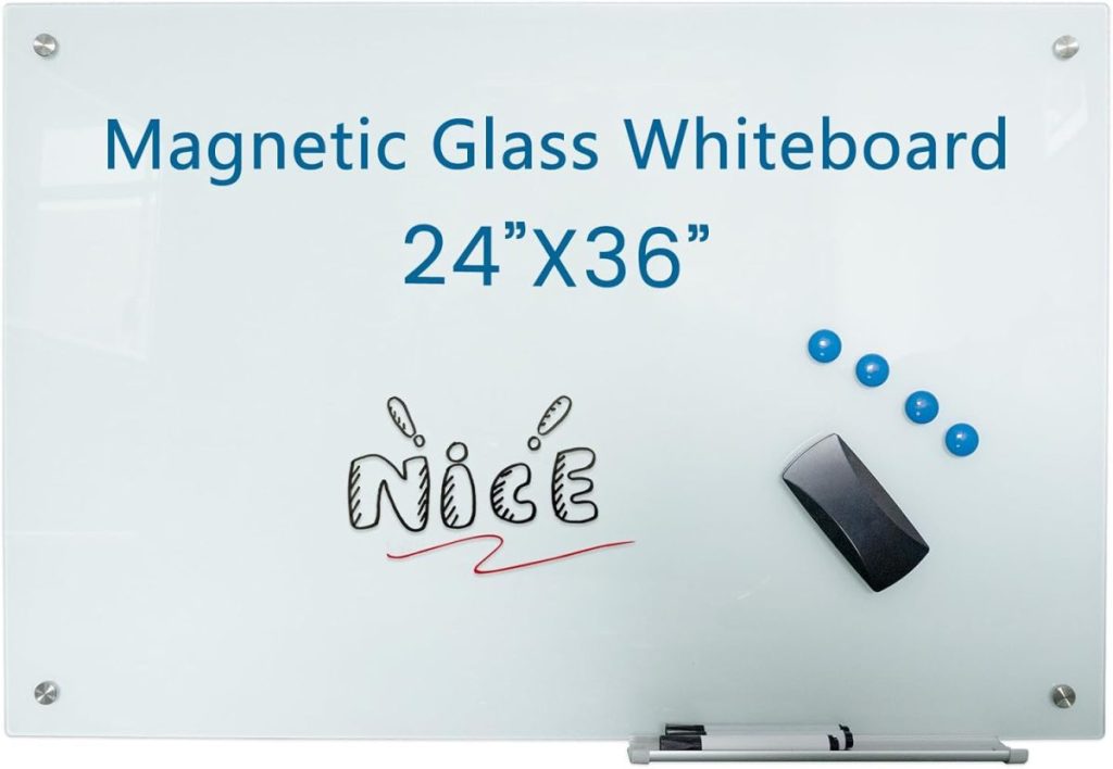 A magnetic glass whiteboard measuring 24 by 36 inches, with four blue magnets, an eraser, and the word "Nice" written in black and red.