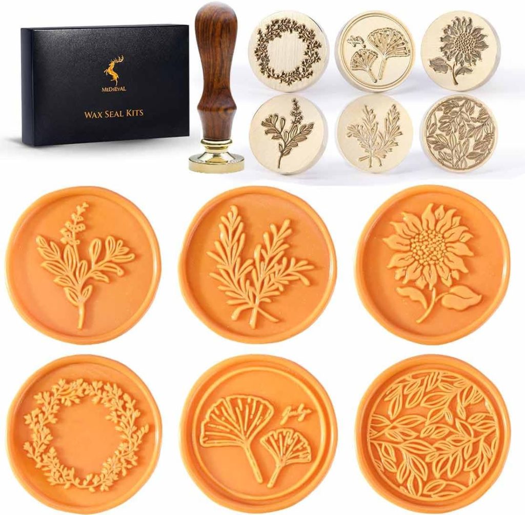 A wax seal kit with a wooden handle, six brass stamp heads featuring botanical designs, and sample orange wax seals displaying the beautifully stamped patterns.