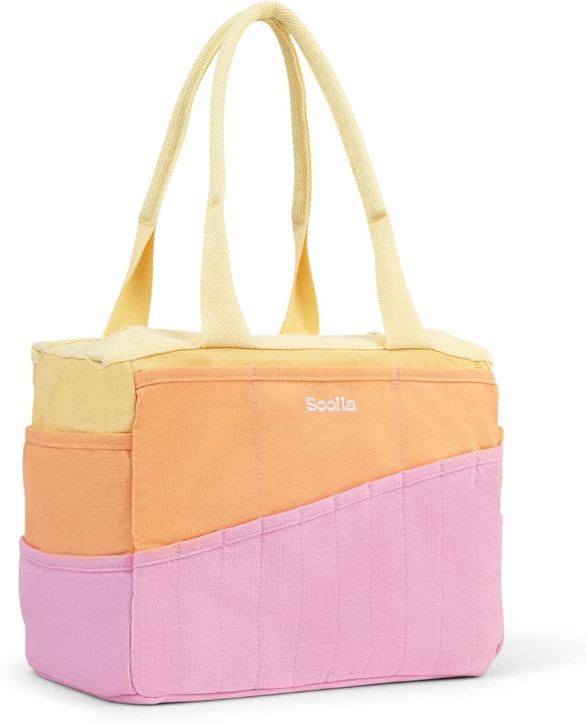 A tote bag with yellow handles and a color-block design featuring yellow, orange, and pink sections, branded with the "Soolla" logo on the front.