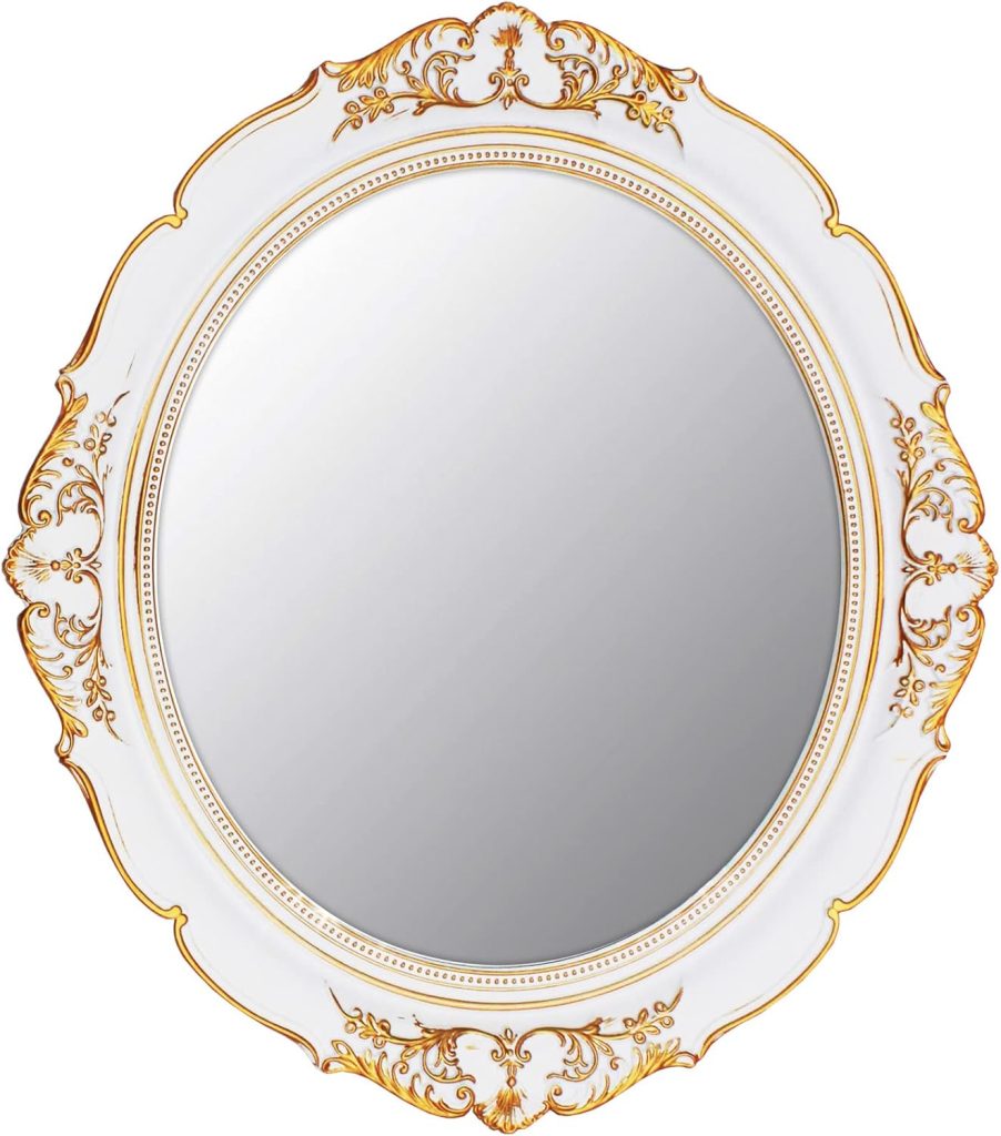 Ornate round coastal mirror with a white and gold decorative frame featuring intricate floral patterns.