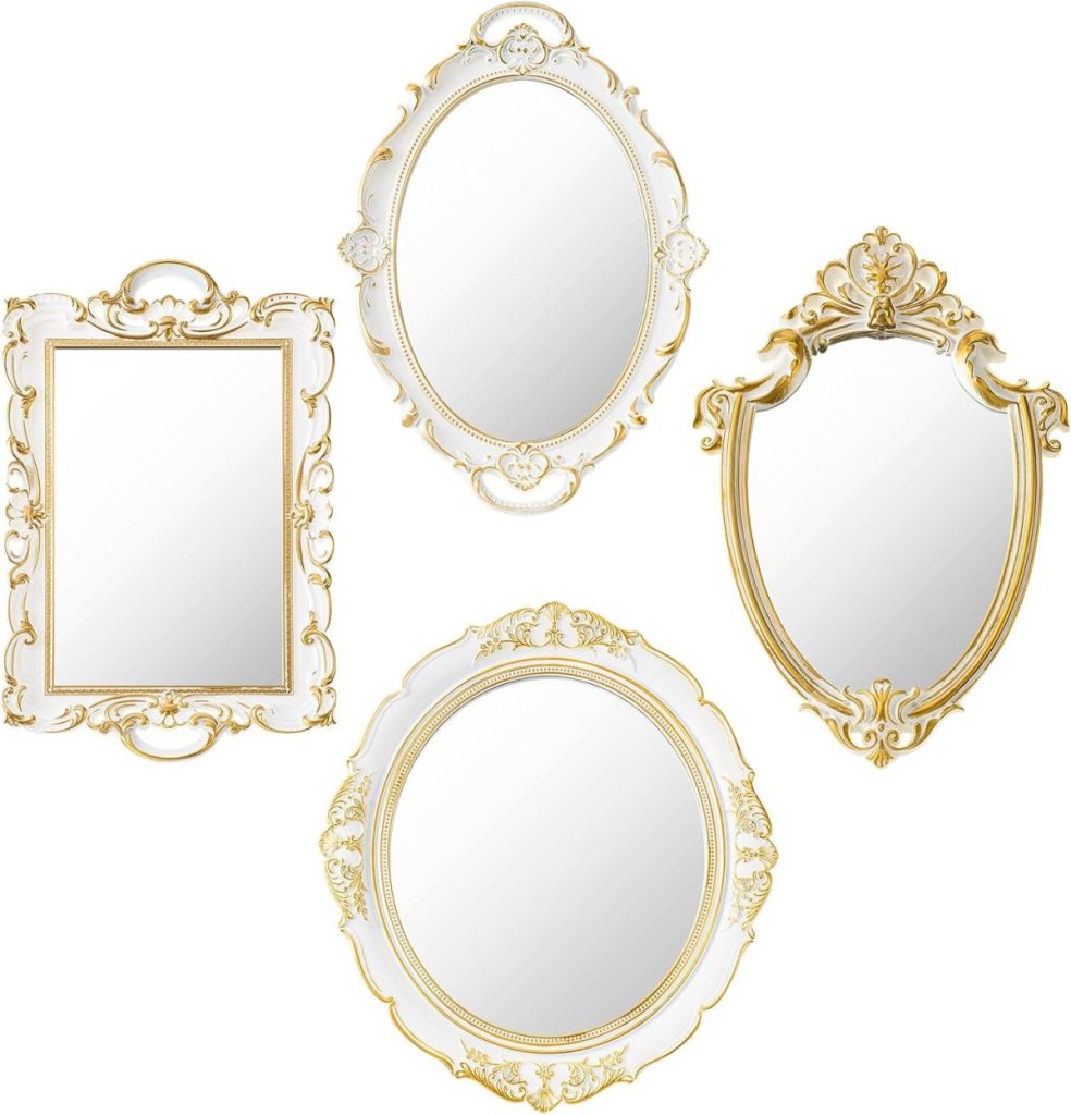 Four ornate mirrors with gold detailing, each a different shape&mdash;rectangle, oval, shield, and round&mdash;are arranged against a white background for a look that blends classic elegance with the airy charm of a coastal mirror display.