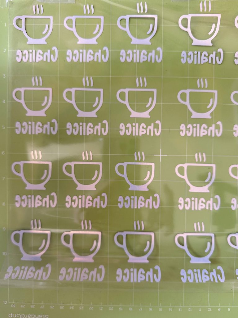 A grid of white coffee cup icons and the word "Chalice" printed in reverse on a transparent green sheet.