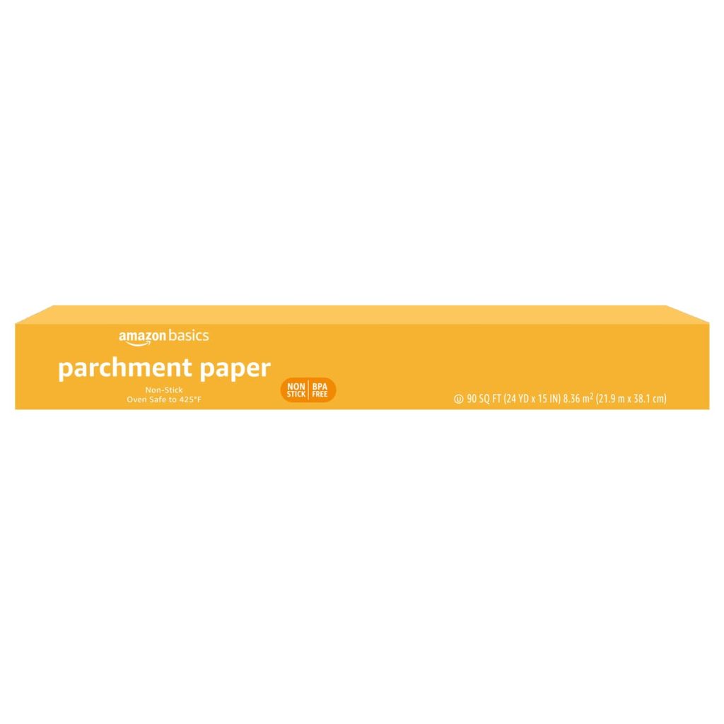 Amazon Basics parchment paper box, non-stick and BPA-free, with dimensions 50 sq ft (12 in x 50 ft), oven safe to 425&deg;F, in yellow packaging.