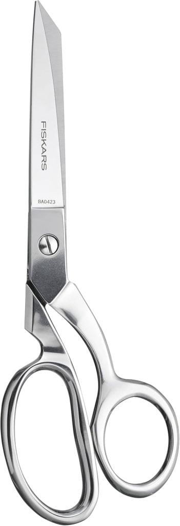 A pair of metallic Fiskars scissors, essential craft tools with sharp blades and ergonomic handles, shown against a white background.