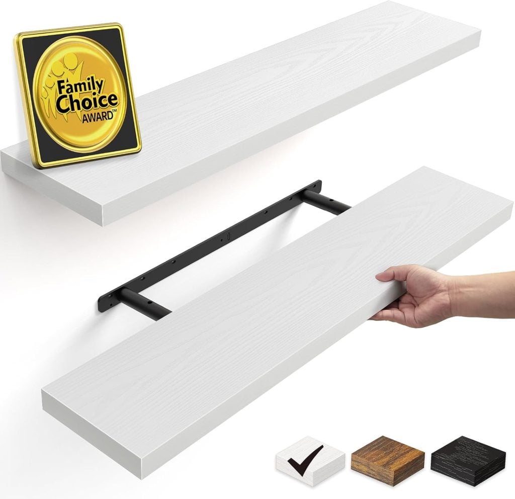 A hand installs a white floating shelf onto a black metal bracket beneath another mounted shelf; a Family Choice Award plaque sits on the top shelf. Three color options are shown.
