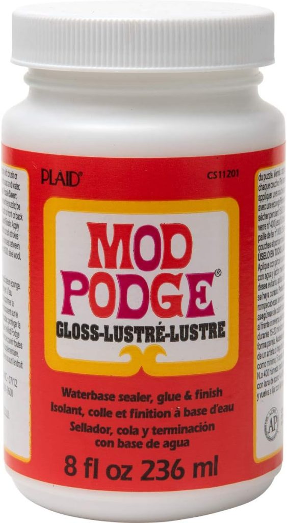 A white plastic jar of Mod Podge Gloss-Lustre, waterbase sealer, glue, and finish, 8 fl oz (236 ml), with red, yellow, and white labeling.