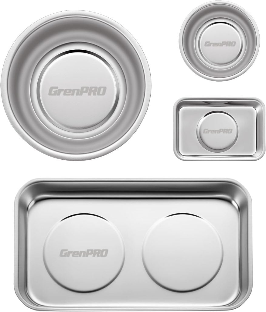 Four stainless steel trays and bowls of various shapes and sizes, each labeled "GrenPRO," arranged on a white background.