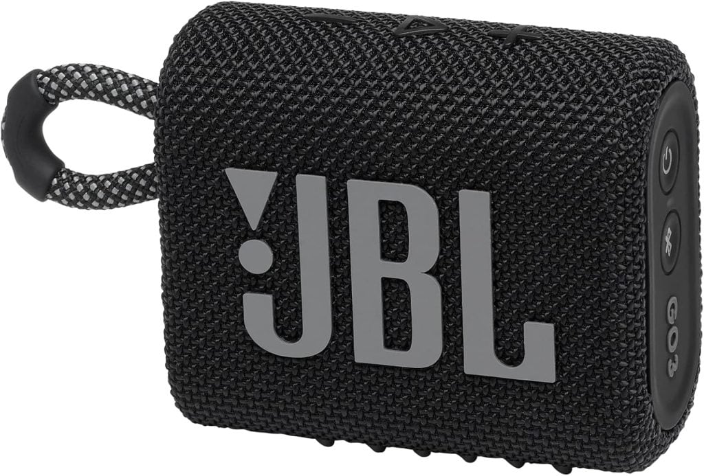 Black JBL portable Bluetooth speaker with a textured fabric exterior, control buttons on the side, and a carrying loop attached.