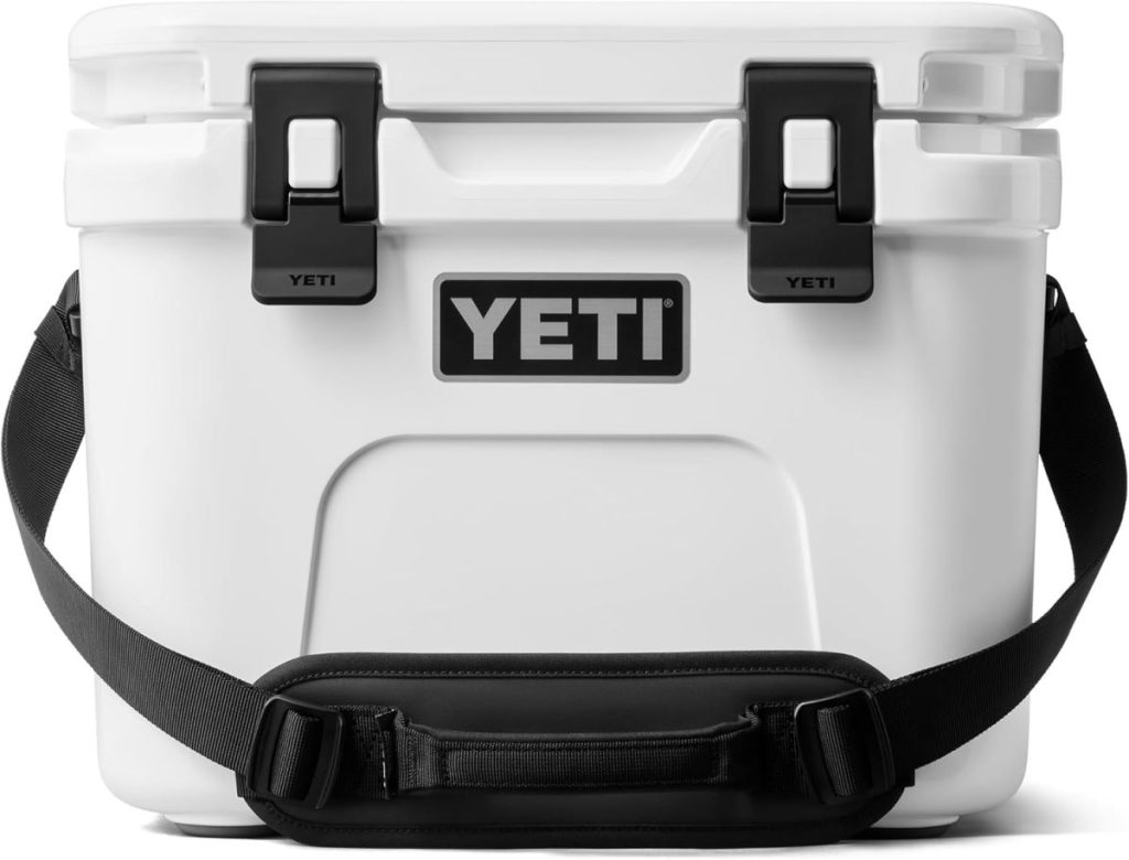 A white YETI cooler with a black shoulder strap and two black latches on the lid, shown from the front&mdash;an ideal Amazon Father's Day gift for outdoor enthusiasts.