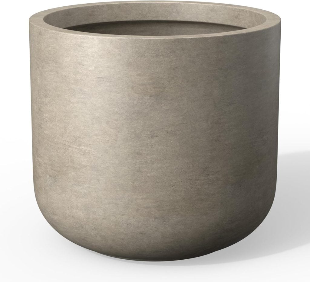 A plain, round, light gray concrete planter with a smooth surface, shown empty against a white background.