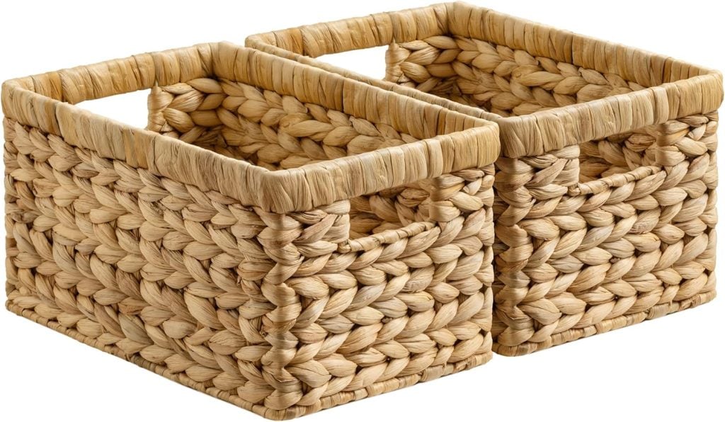 Two rectangular woven baskets with handles, placed side by side, made from natural-colored braided material.