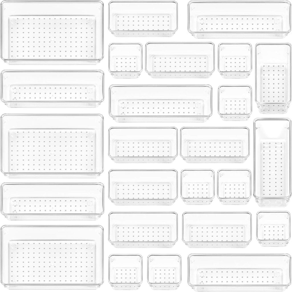 A variety of clear, rectangular perforated plastic storage bins arranged in a grid pattern on a white background.