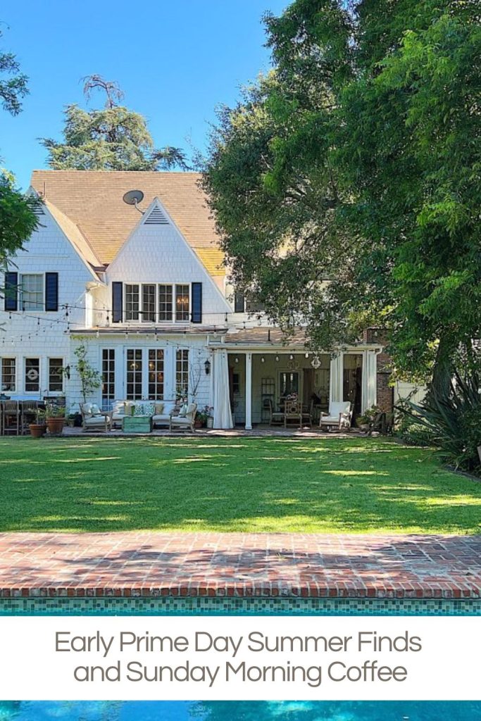 Large white house with a porch and outdoor seating, surrounded by trees and a lawn, with a swimming pool in the foreground. Text overlay reads: “Early Prime Day Summer Finds and Sunday Morning Coffee.”.
