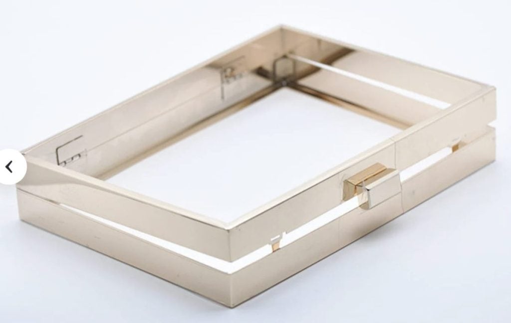 A rectangular, metallic, gold-toned frame with clean lines and a modern, minimalist design, photographed against a plain white background.