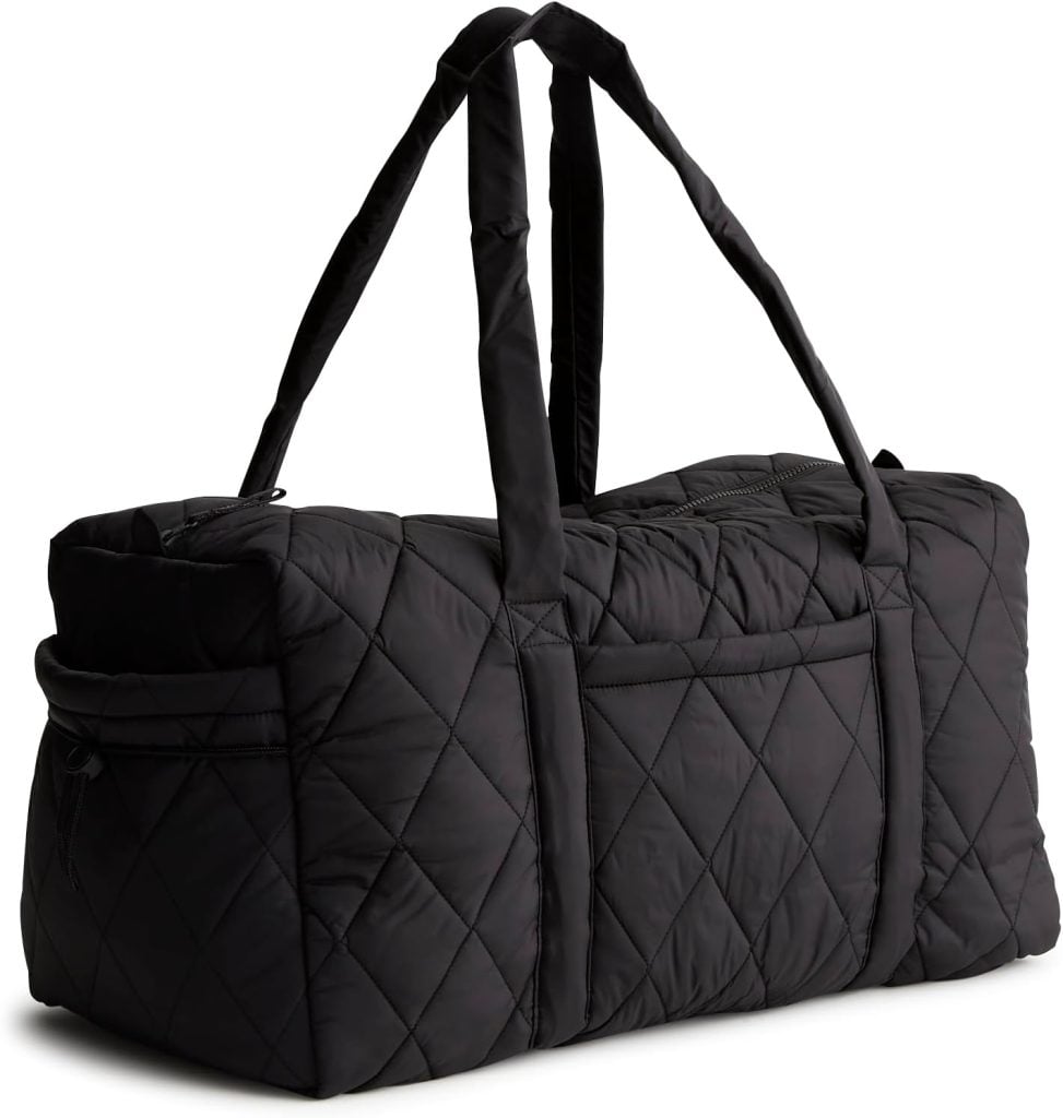 Black quilted duffel bag with two shoulder straps, a zippered main compartment, and side pockets, shown against a white background.