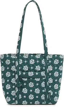 Dark green quilted tote bag with white floral pattern, two long straps, and a front zippered pocket.