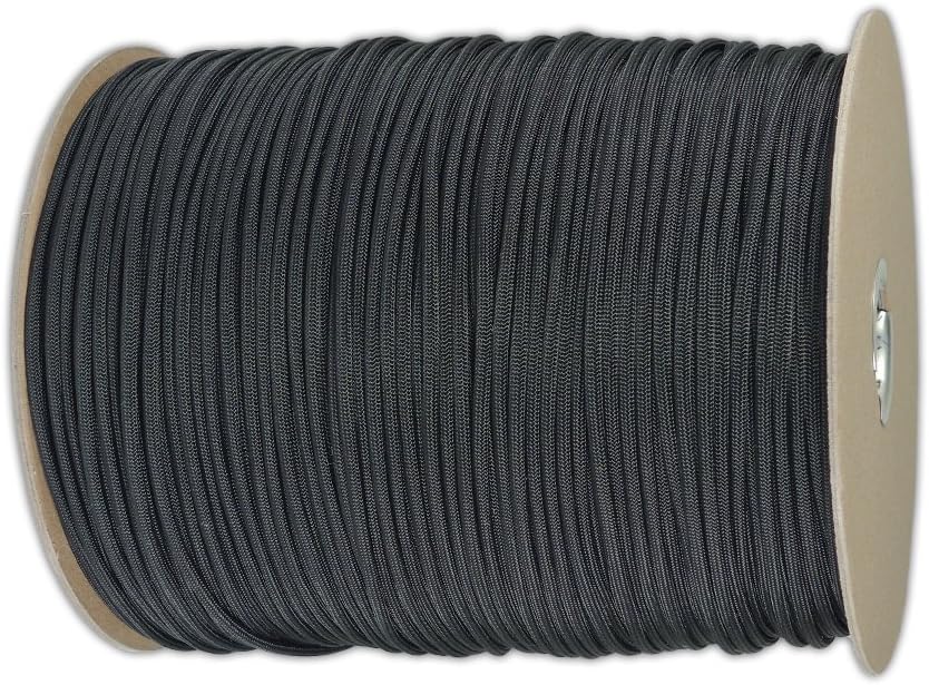 A large spool of black paracord is tightly wound around a cardboard reel, viewed from the side against a white background.